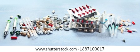 Similar – Image, Stock Photo Assorted pharmaceutical medicine pills, tablets and capsules