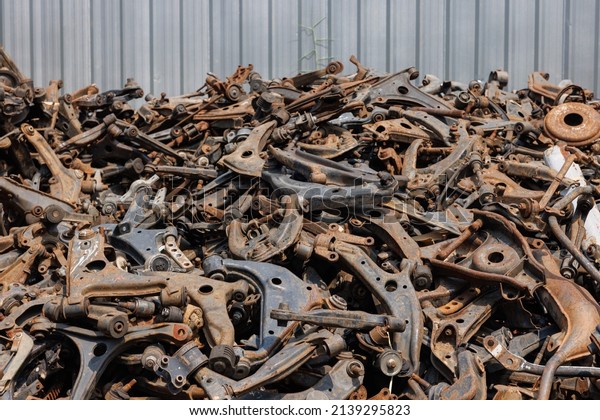 heap of waste automotive parts in recycle factory. scrap\
metal - predominantly ferrous metals. Waste from industry and\
household in recycle factory. scrap metal - predominantly ferrous\
metals. 