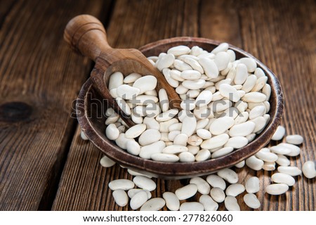 Heap of White Beans (close-up shot) on an old wooden table) Stock foto © 