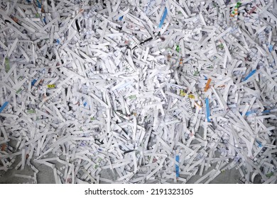Heap of white shredded papers background, closeup