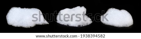 A heap of white soap foam isolated on black background.