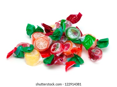 heap of wrapped fruit candies isolated on white background - Powered by Shutterstock