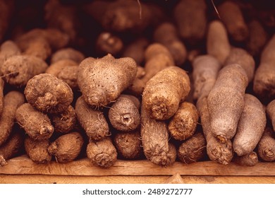 A heap of yams displayed at a market