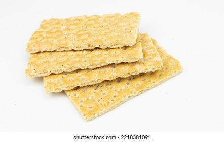 A Heap Of Yellow Wholegrain Crisp Bread Isolated On White Background,clipping Path. Cracker Crispbread Square Low Calorie Good For Health,  Top View