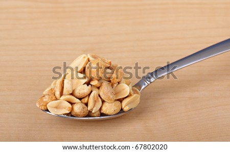 heaping spoonful peanuts on