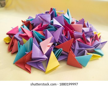 heaps of different color of origami 3d triangle pieces of papers .wallpaers