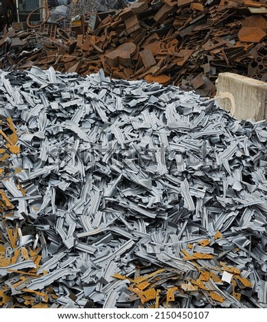 Heaps of ferrous and non-ferrous scrap metal at scrap works