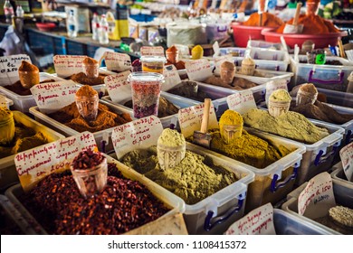 Heaps of spices on the market in Yerevan, Armenia. Tashir traditional market in Armenia. TRANSLATION of writing in Russian and Armenian: Pepper, paprika, coriander, zira, suneli, Armenia