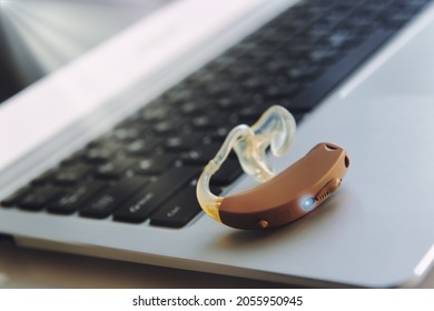 Hearing Aid Device On Laptop, Work In Office For Deaf People