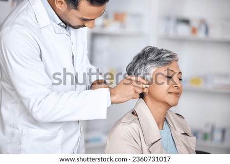 Hearing aid, medical and consulting with doctor and woman with a disability for healthcare, technology and sound waves. Medicine, wellness and audio with people and cochlear implant for treatment