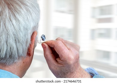 Hearing Aid In A Senior Man