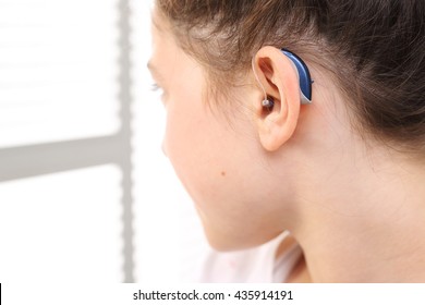 Hearing Aid For Your Child . The Girl Assumes Hearing Aid.