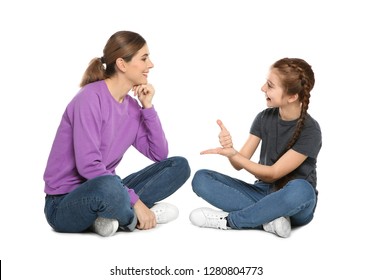 Hearing Impaired Mother And Her Child Talking With Help Of Sign Language On White Background