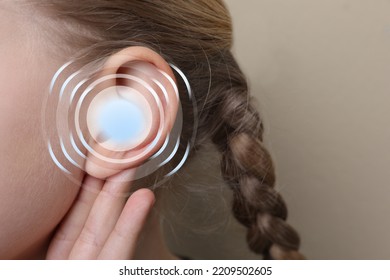 Hearing Loss Concept. Little Girl And Sound Waves Illustration On Beige Background, Closeup