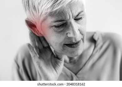 Hearing Loss. Senior Woman With Symptoms Of Hearing Loss.