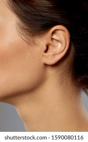 Hearing, People And Beauty Concept - Close Up Of Young Woman Ear