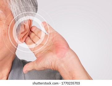 Hearing Test Concept,Close Up Senior Woman With Hearing Loss On White Background.