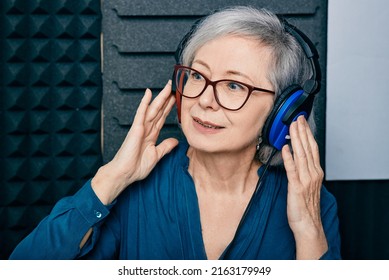 Hearing Test At Senior Woman. Gray-haired Mature Woman During Hearing Exam And Audiometry At Hearing Clinic