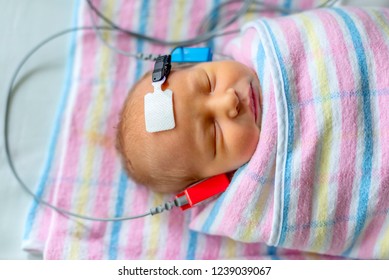 Hearing Test Of A Sleeping Newborn At Hospital