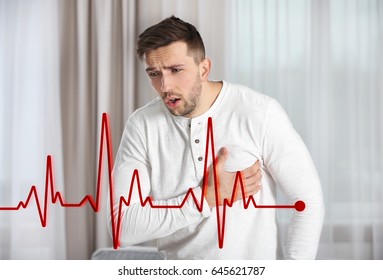 Heart Attack Concept. Man Suffering From Chest Pain Indoor