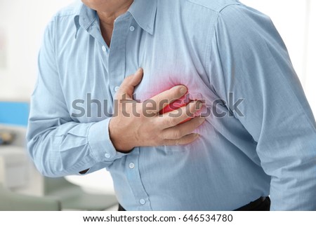 Heart attack concept. Senior man suffering from chest pain, closeup