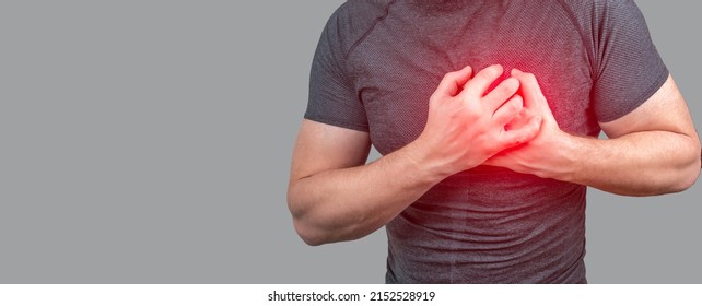 heart attack. Man clutching his chest from acute pain. Heart attack symptom. Severe heartache, man suffering from chest pain, having heart attack or painful cramps, pressing on chest - Shutterstock ID 2152528919