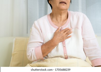 Heart Attack Old Woman Holding Chest In Bed Room, Healthcare Problem Of Senior Concept