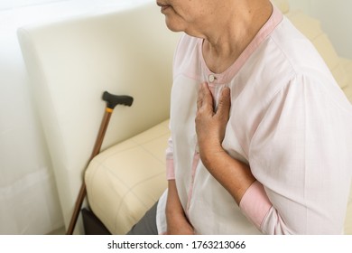 Heart Attack Old Woman Holding Chest In Bed Room, Healthcare Problem Of Senior Concept