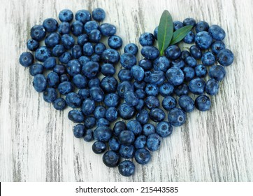 Heart Of Blueberries On Wooden Background