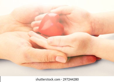 Heart In Child And Mother Hands Close Up