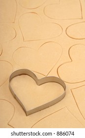 Heart Cookie Cutter On A Sheet Of Cookie Dough