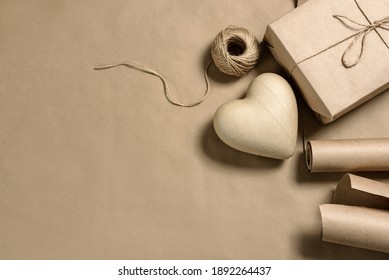 Papier-mâché Heart, And Craft Packaging On A Background With Copy Space. Gift Decoration.