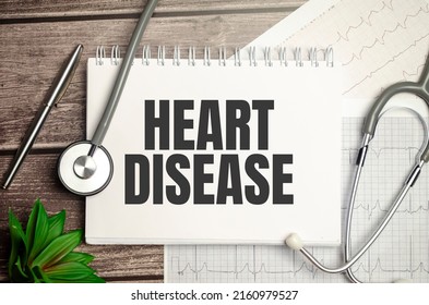Heart Disease sign on notebook with stethoscope and cardio charts