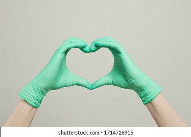 Heart Of Doctor Gloves Hands. The Heart From The Hands In Medical Gloves On White Background