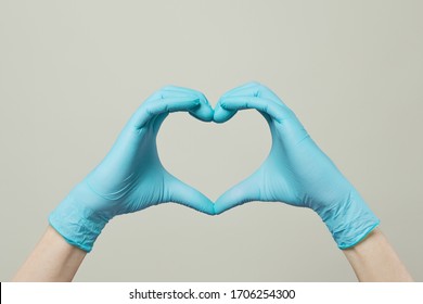 Heart From Doctor Hands In Medical Gloves On White Background