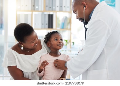 Heart Doctor, Mother And Child At A Hospital For Checkup, Examination Or Medical Advice At A Clinic. Black Healthcare Man In Cardiology Checking Little Girl Patient In Medicare, Examine Appointment.