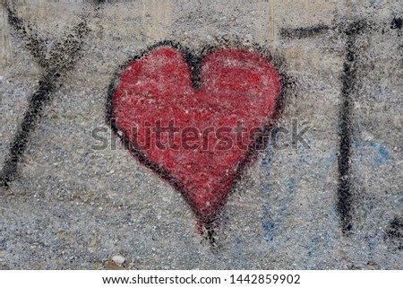 Similar – UT Only floating is more beautiful I Painted heart on the house wall