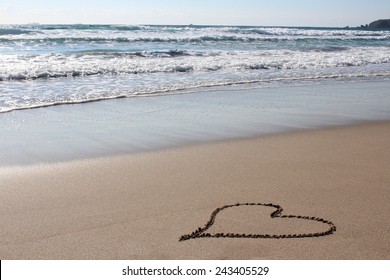 Heart drawn on the beach 