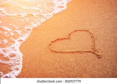 Heart Drawn In The Sand Of Sea Beach