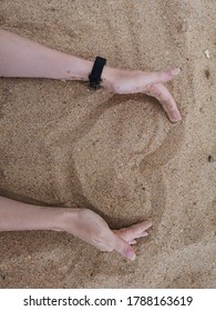 A Heart Drawn In The Sand And A Woman's Arms Around It