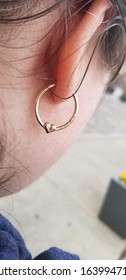 Heart Earring On A Woman