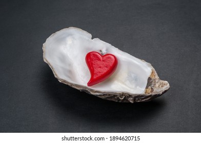 Heart In Empty Oyster Shell On Black Background. Valentines Day Card