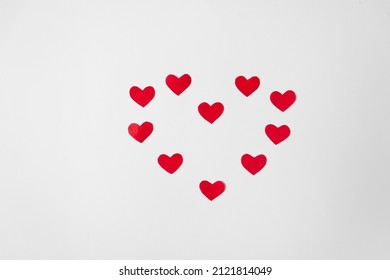 The Heart Form Is Made Up Of Many Red Paper Hearts Isolated On White Background. Valentine's Day Concept.