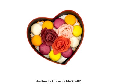 heart gift box of French colorful Macarons Cookies with red and pink roses flowers for valentine's or women's or mother's day holiday  - Powered by Shutterstock