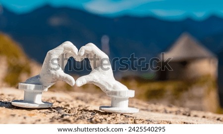 Heart hands gesture with a 3D printed sculpture - free model from thingiverse - at Ehrenberg castle ruins near Reutte, Tyrol, Austria