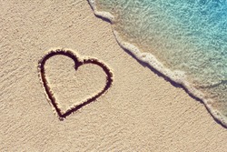 Heart Handwritten On A Sand Of Beach With Wave On Background