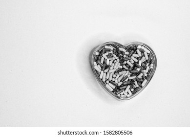 Heart Healthy Medication In A Heart Shape Container On An Isolated Background. 