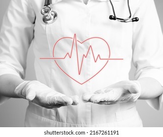 Heart with heartbeat rhythm over doctor hands in gloves. Electrocardiogram test conducting, checking for heart problems concept. Cardiologist job. Black and white. High quality photo