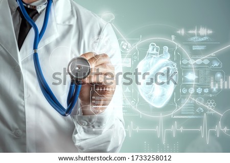 Heart hologram and doctor, heart disease. Health care of the future. Modern Medical Science, Hi Tech Diagnostic Panel. Mixed medium, copy space