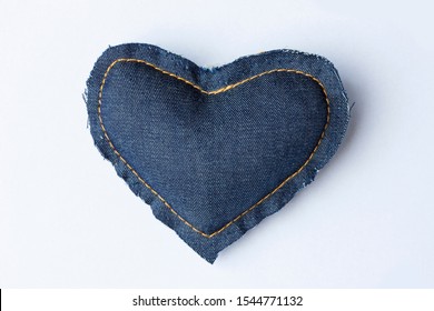 
heart of jeans fabric on white background